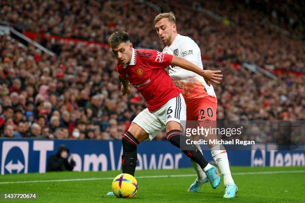 Lisandro Martinez of Manchester United and Jarrod Bowen of West Ham United battle for the ball during the Premier League match between Manchester...