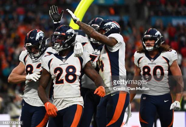 Latavius Murray of the Denver Broncos celebrates with teammates after scoring a touchdown during the fourth quarter in the NFL match between Denver...