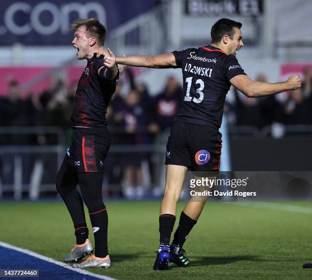 Nick Tompkins of Saracens celebrates with team mate Alex Lozowski, after scoring their fourth try during the Gallagher Premiership Rugby match...
