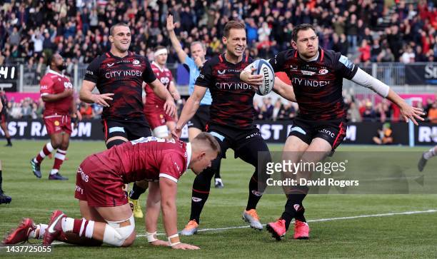 Alex Goode of Saracens celebrates after scoring their first try during the Gallagher Premiership Rugby match between Saracens and Sale Sharks at the...
