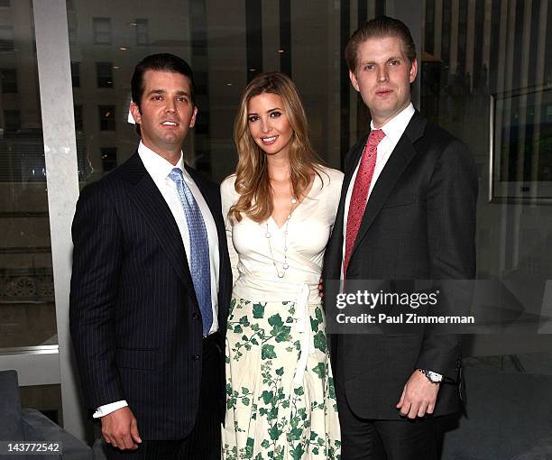 Donald Trump, Jr., Ivanka Trump and Eric Trump pose for pictures at Trump Tower on May 3, 2012 in New York City.