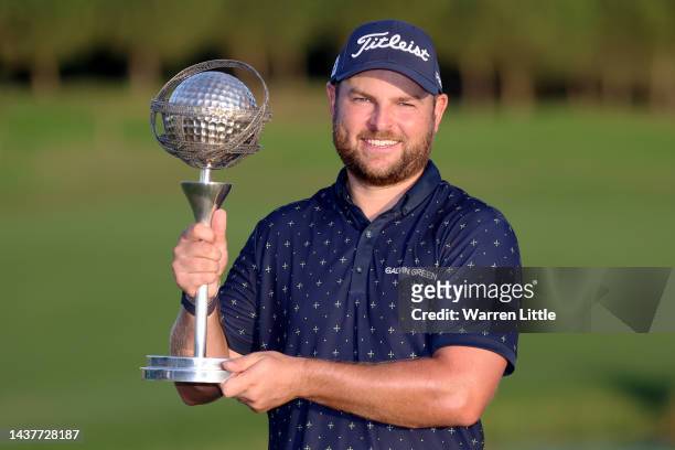 Jordan Smith of England poses for a photograph with the trophy after winning the Portugal Masters during Day Four of the Portugal Masters at Dom...