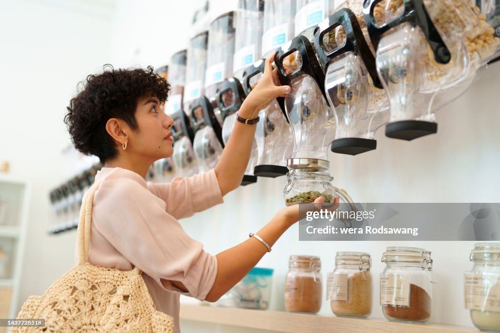 Woman shopping in refill store