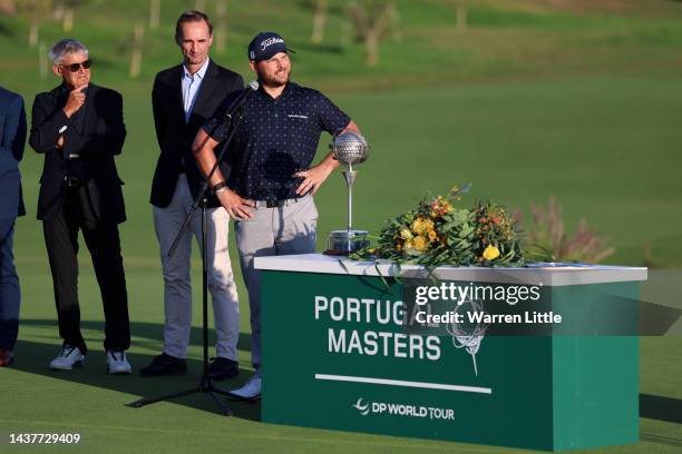 Jordan Smith of England looks on after winning the Portugal Masters during the trophy presentation ceremony during Day Four of the Portugal Masters...