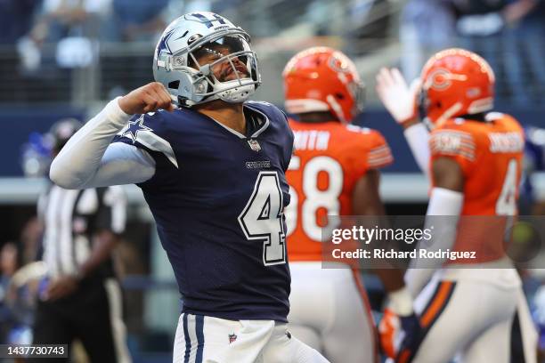 Dak Prescott of the Dallas Cowboys celebrates a touchdown pass against the Chicago Bears during the first quarter at AT&T Stadium on October 30, 2022...