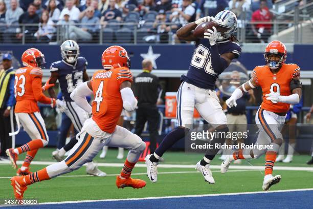 CeeDee Lamb of the Dallas Cowboys catches a touchdown pass against Eddie Jackson of the Chicago Bears during the first quarter at AT&T Stadium on...