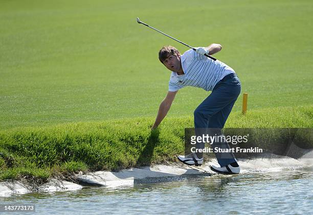 Robert Rock of England reacts after playing a shot on the 14th hole during the first round of the Open de Espana at Real Club de Golf de Sevilla on...