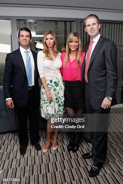 Donald Trump ,Jr., Ivanka Trump, Debbie Matenopoulos and Eric Trump pose at Trump Tower on May 3, 2012 in New York City.