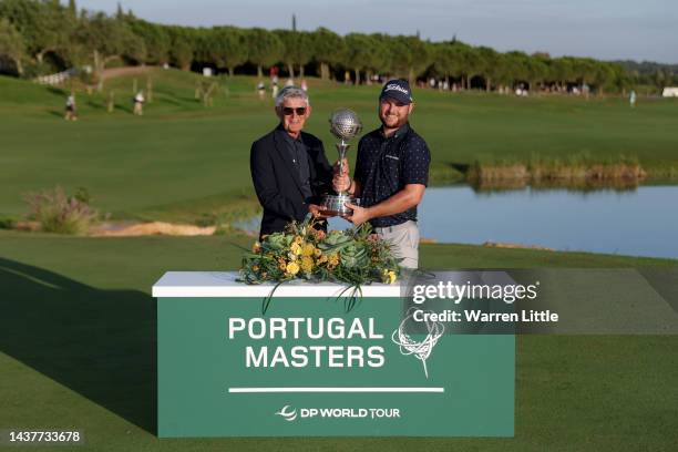 David Williams, Chairman of the DP World Tour, poses for a photograph with Jordan Smith of England during Day Four of the Portugal Masters at Dom...