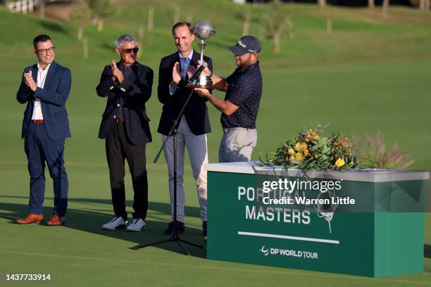 Jordan Smith of England is presented with the trophy during the presentation ceremony after winning the Portduring Day Four of the Portugal Masters...