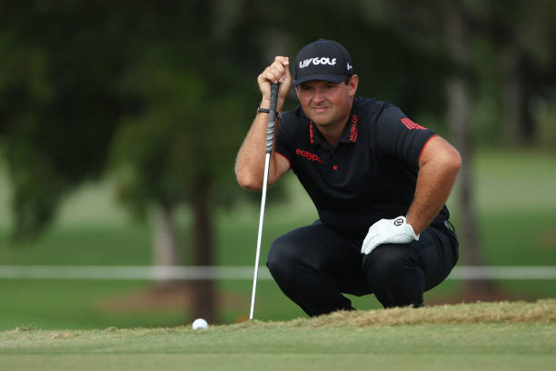 Patrick Reed of 4 Aces GC lines up a putt on the third green during the team championship stroke-play round of the LIV Golf Invitational - Miami at...