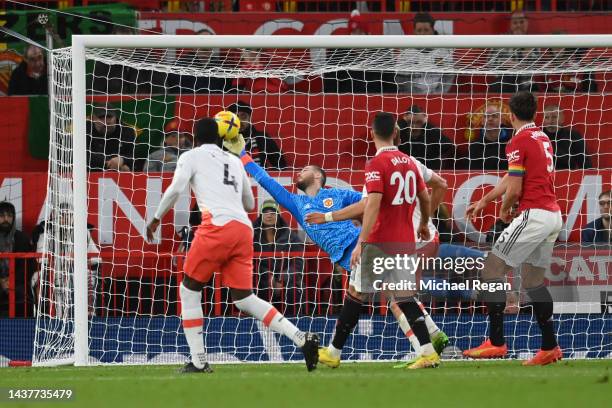 David De Gea of Manchester United makes a save from Kurt Zouma of West Ham United during the Premier League match between Manchester United and West...