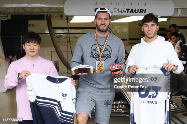 Yuki Tsunoda of Japan and Scuderia AlphaTauri, Andre-Pierre Gignac and Pierre Gasly of France and Scuderia AlphaTauri pose for a photo prior to the...