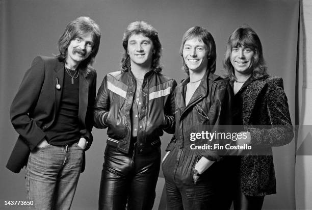 English group Smokie posed in London in July 1980. Left to right: drummer Pete Spencer, bass player Terry Uttley, vocalist and guitarist Chris Norman...