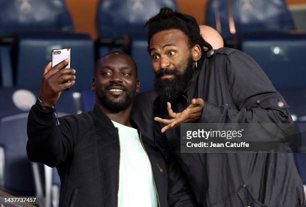 Ladji Doucoure, Ronny Turiaf attend the Ligue 1 match between Paris Saint-Germain and ESTAC Troyes at Parc des Princes stadium on October 29, 2022 in...