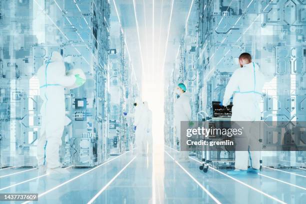 futuristic server room with quantum computers and group of scientists - clean suit 個照片及圖片檔