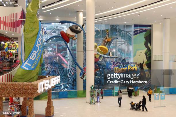 People walk past the Dreamworks Water Park attraction at the American Dream, retail and entertainment complex on October 29 in East Rutherford, New...