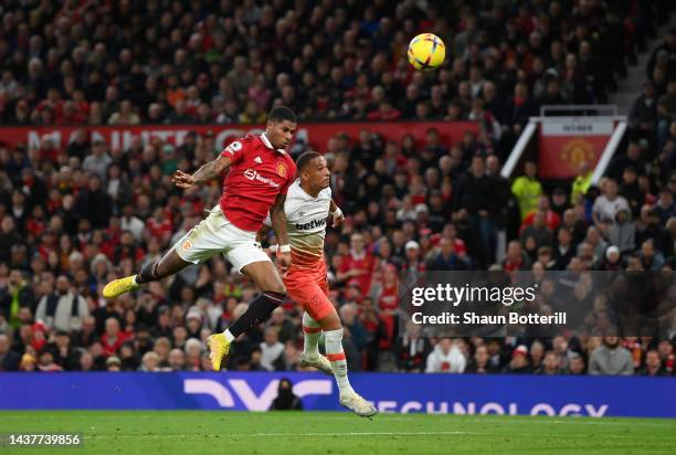 Marcus Rashford of Manchester United beats Thilo Kehrer of West Ham United tom head the first goal during the Premier League match between Manchester...