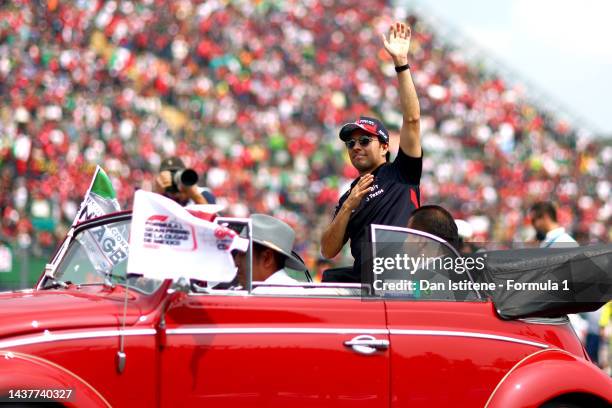 Sergio Perez of Mexico and Oracle Red Bull Racing waves to the crowd on the drivers parade prior to the F1 Grand Prix of Mexico at Autodromo Hermanos...