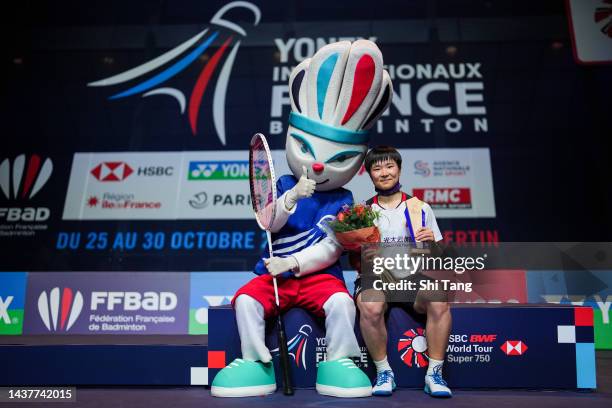 He Bingjiao of China poses with her trophy on the podium after the Women's Single Final match against Carolina Marin of Spain during day six of the...