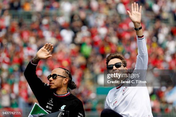 Lewis Hamilton of Great Britain and Mercedes and George Russell of Great Britain and Mercedes wave to the crowd on the drivers parade prior to the F1...