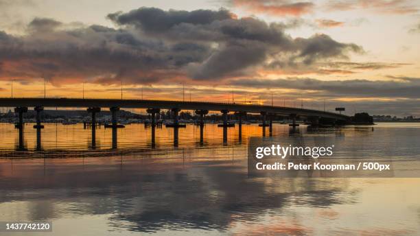 scenic view of sea against sky during sunset,tauranga,new zealand - tauranga stockfoto's en -beelden