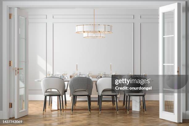 entrance of dining room with dining table, chairs and empty white wall in background - luxury home stock pictures, royalty-free photos & images