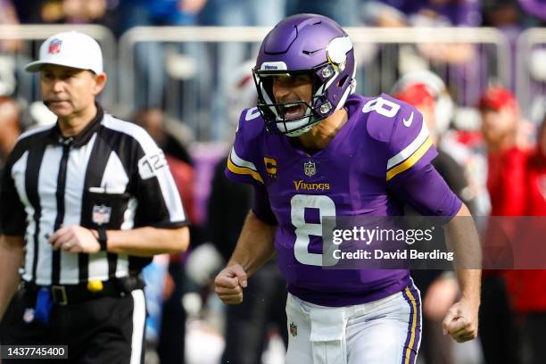 Kirk Cousins of the Minnesota Vikings celebrates a touchdown during the second quarter against the Arizona Cardinals at U.S. Bank Stadium on October...