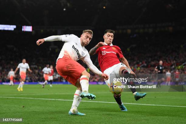 Jarrod Bowen of West Ham United and Lisandro Martinez of Manchester United challenge for the ball during the Premier League match between Manchester...