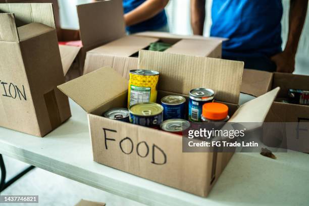 close-up of a food donation box - canned food stock pictures, royalty-free photos & images