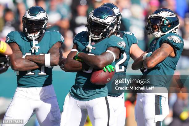 From left, A.J. Brown, Zach Pascal and DeVonta Smith of the Philadelphia Eagles celebrates a third quarter touchdown during a game against the...