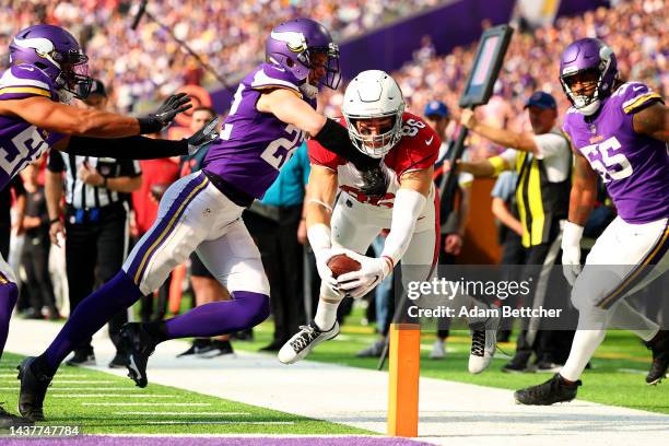 Zach Ertz of the Arizona Cardinals scores a touchdown as Harrison Smith of the Minnesota Vikings defends during the third quarter at U.S. Bank...