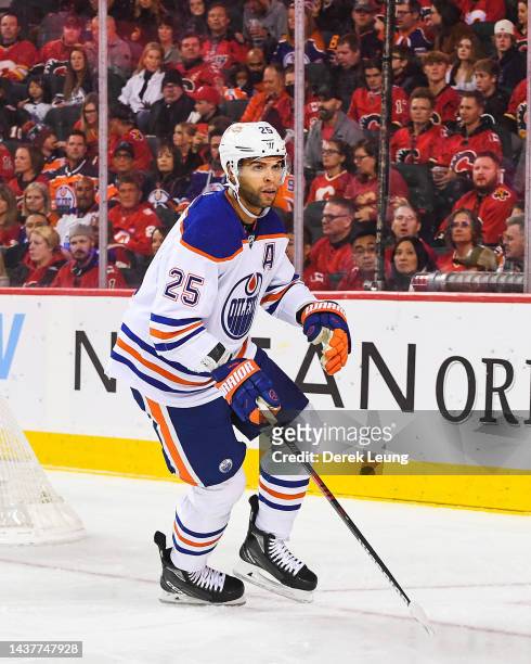 Darnell Nurse of the Edmonton Oilers in action against the Calgary Flames during an NHL game at Scotiabank Saddledome on October 29, 2022 in Calgary,...