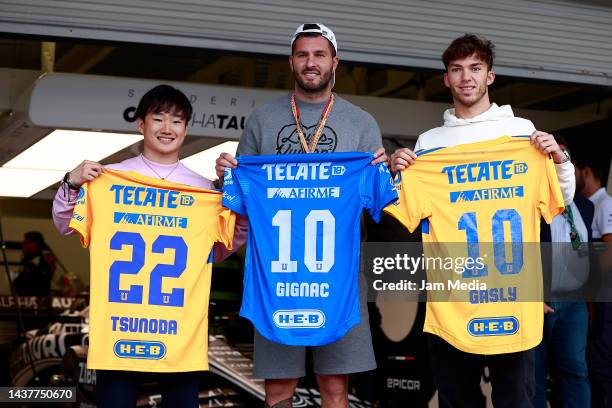 Yuki Tsunoda of Japan and Scuderia AlphaTauri, Pierre Gasly of France and Scuderia AlphaTauri and Andre-Pierre Gignac pose prior to the F1 Grand Prix...