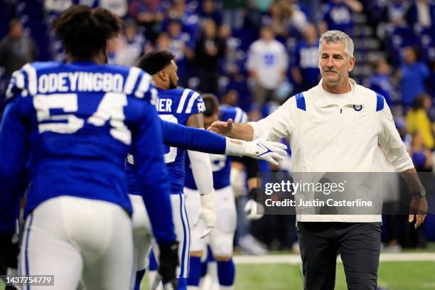 Head coach Frank Reich of the Indianapolis Colts greets his players before a game against the Washington Commanders at Lucas Oil Stadium on October...