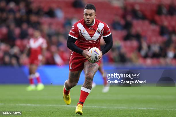 Addin Fonua-Blake of Tonga runs with the ball during the Rugby League World Cup 2021 Pool D match between Tonga and Cook Islands at Riverside Stadium...