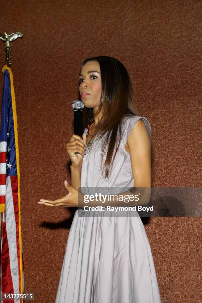 Singer Michelle Williams of Destiny's Child speaks to young girls during the BAP School Of Charm's Inaugural High Tea at the Charles Hayes Center in...