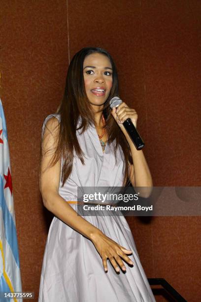 Singer Michelle Williams of Destiny's Child speaks to young girls during the BAP School Of Charm's Inaugural High Tea at the Charles Hayes Center in...