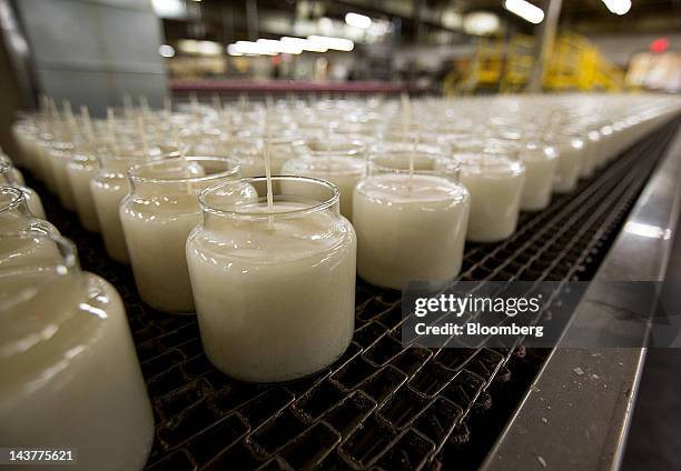 Finished candles sit at a Yankee Candle Co. factory in Whately,... News Photo