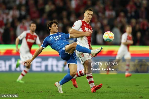 Eduardo Quaresma of TSG Hoffenheim battles for possession with Florian Dietz of FC Koln during the Bundesliga match between 1. FC Koeln and TSG...