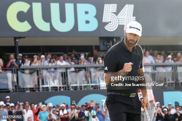 Team Captain Dustin Johnson of 4 Aces GC celebrates making his putt on the 18th green and the 4 Aces GC team win during the team championship...
