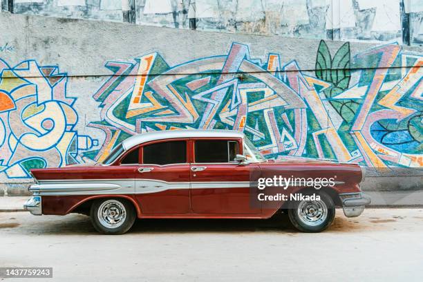 old american vintage car driving on havana street. - 1950 2015 stock pictures, royalty-free photos & images
