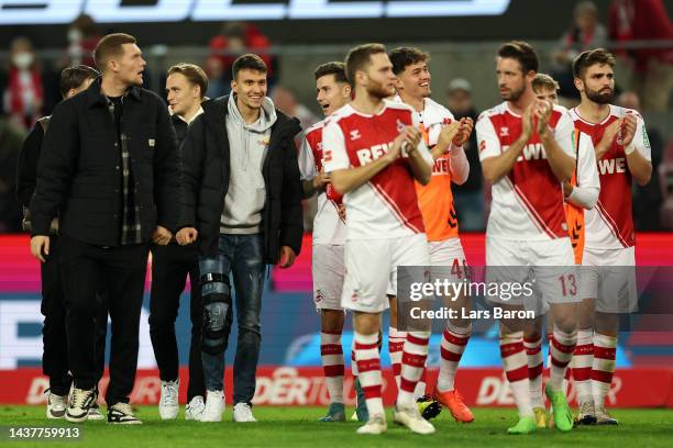 Dejan Ljubicic of FC Koln looks on as teammates applaud fans after following the Bundesliga match between 1. FC Koeln and TSG Hoffenheim at...