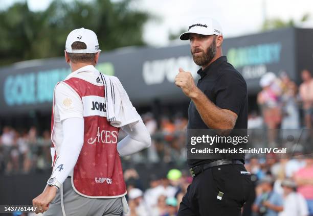 Team Captain Dustin Johnson of 4 Aces GC celebrates making his putt on the 18th green to win the team championship stroke-play round of the LIV Golf...