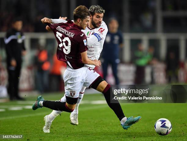 Aleksei Miranchuk of Torino FC battles for possession with Theo Hernandez of AC Milan during the Serie A match between Torino FC and AC MIlan at...