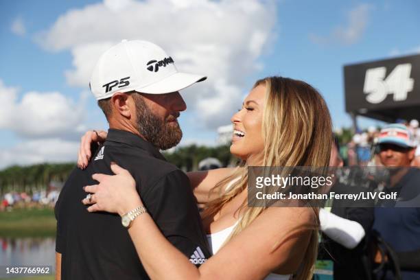 Team Captain Dustin Johnson of 4 Aces GC and wife Paulina Gretzky celebrate the 4 Aces GC team win on the 18th green during the team championship...