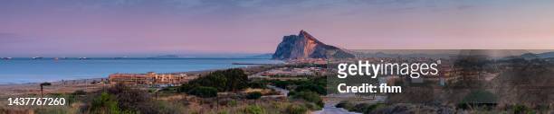 gibraltar and la linea de la conception at sunset - morocco (africa) in the background (spain and gibraltar/ uk) - la linea de conception stock pictures, royalty-free photos & images