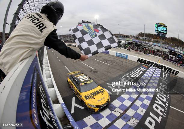 Christopher Bell, driver of the DeWalt Toyota, takes the checkered flag to win the NASCAR Cup Series Xfinity 500 at Martinsville Speedway on October...