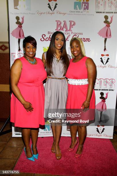 Singer Michelle Williams of Destiny's Child poses for photos with Thyatiria Towns and Syreeta Talbert during the BAP School Of Charm's Inaugural High...
