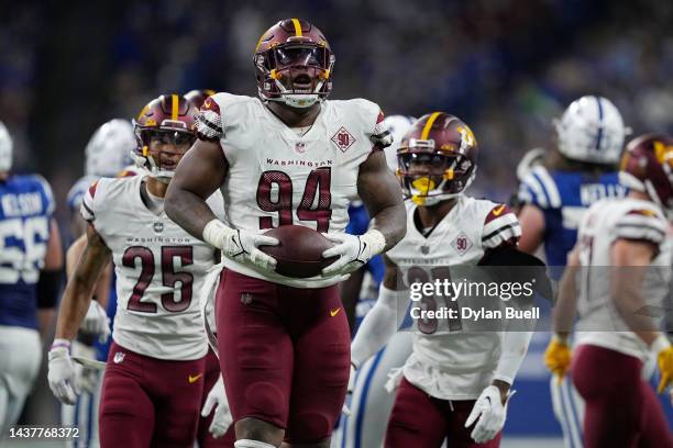 Daron Payne of the Washington Commanders reacts after recovering a fumble in the second quarter of a game against the Indianapolis Colts at Lucas Oil...